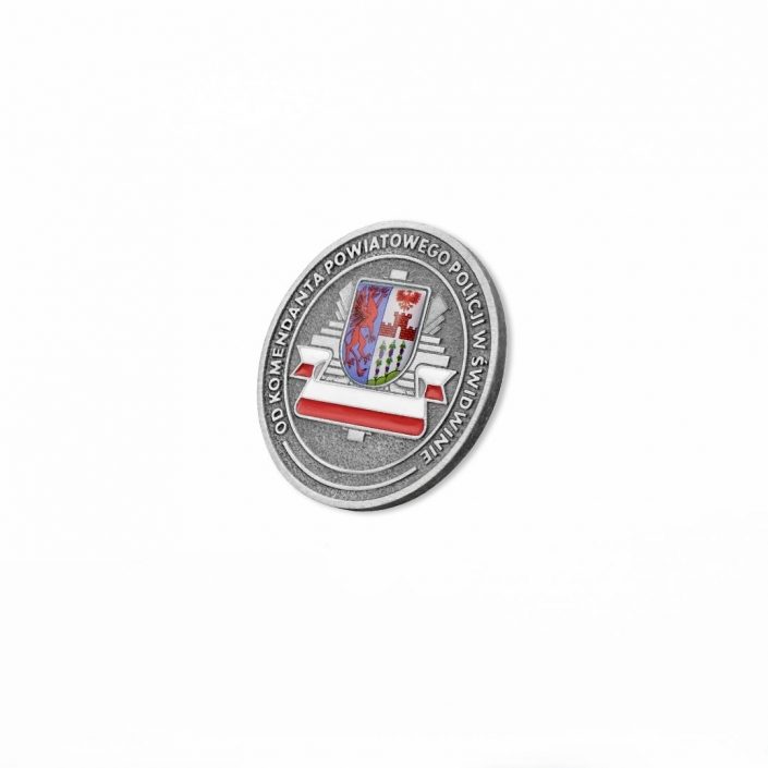 Moneta odlewana z wklejką 3D przedstawiająca kompozycją herbu miejskiego oraz odznaki policyjnej