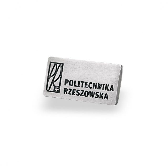Przypinka metalowa w kolorze srebra wyprodukowana dla Politechniki Rzeszowskiej